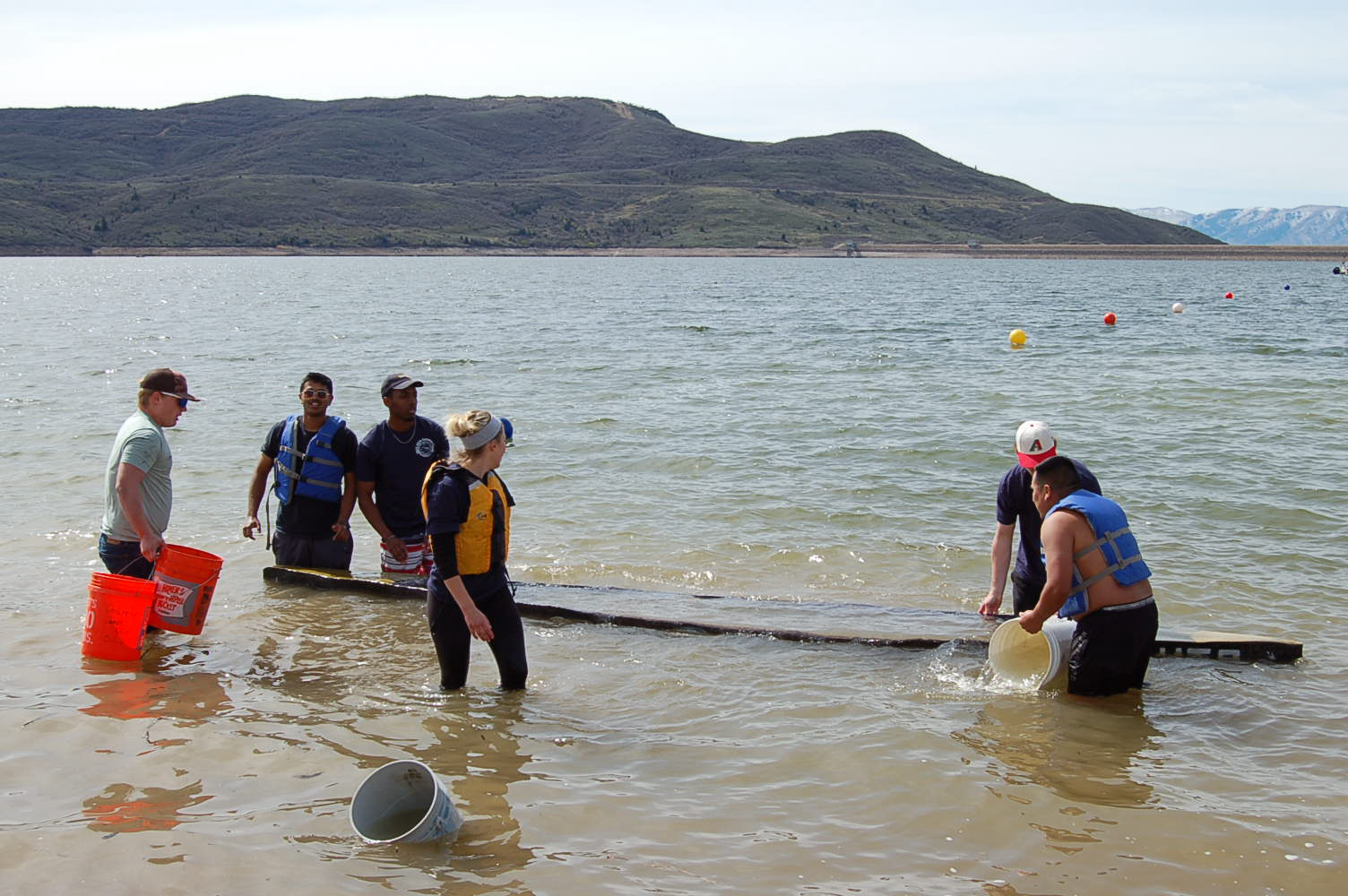 Team launching canoe