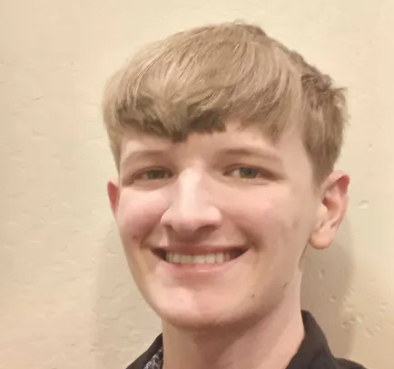 Headshot of Asher Romanenghi